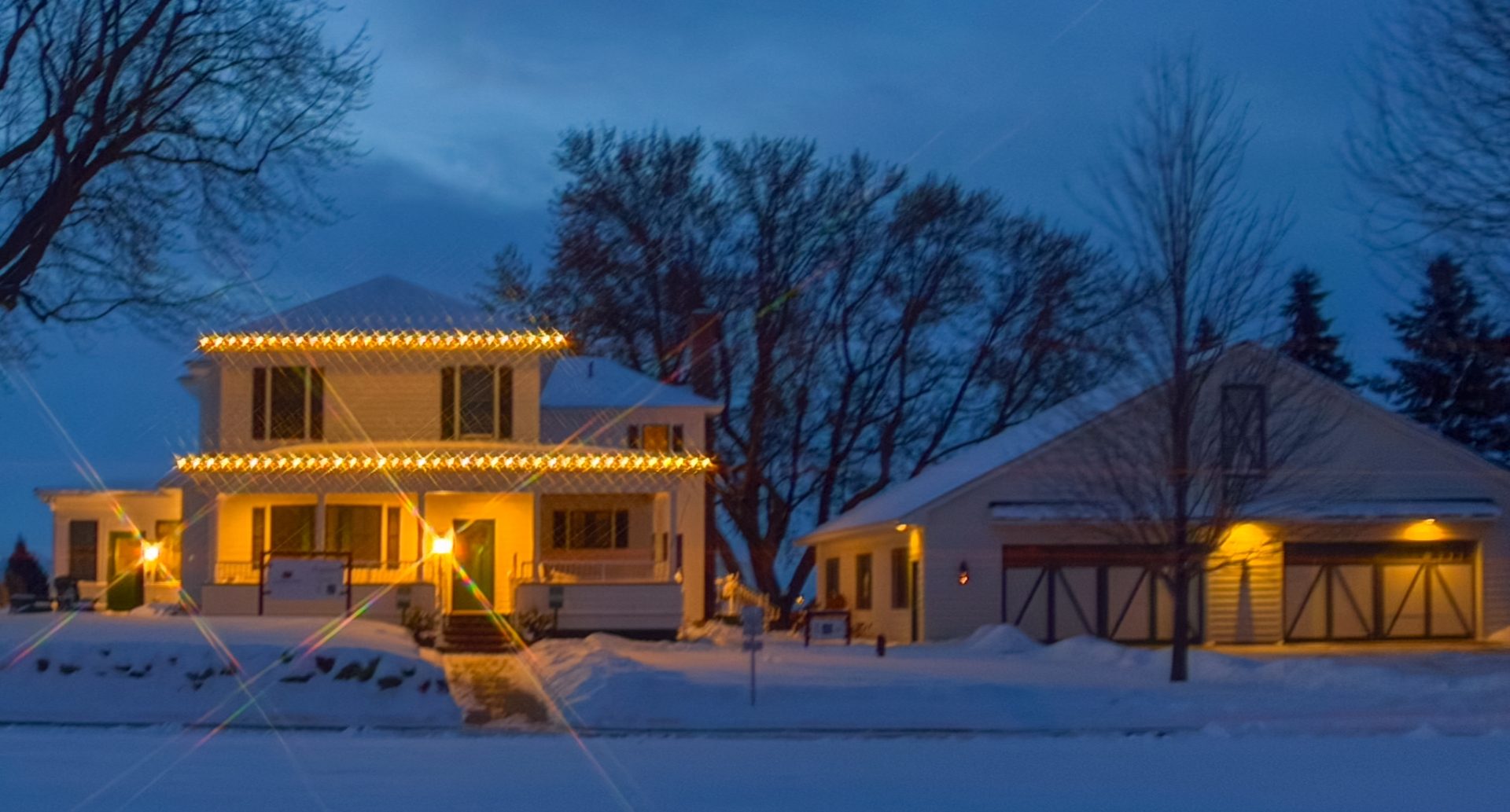 Design Studio with Holiday lights on the rooflines.