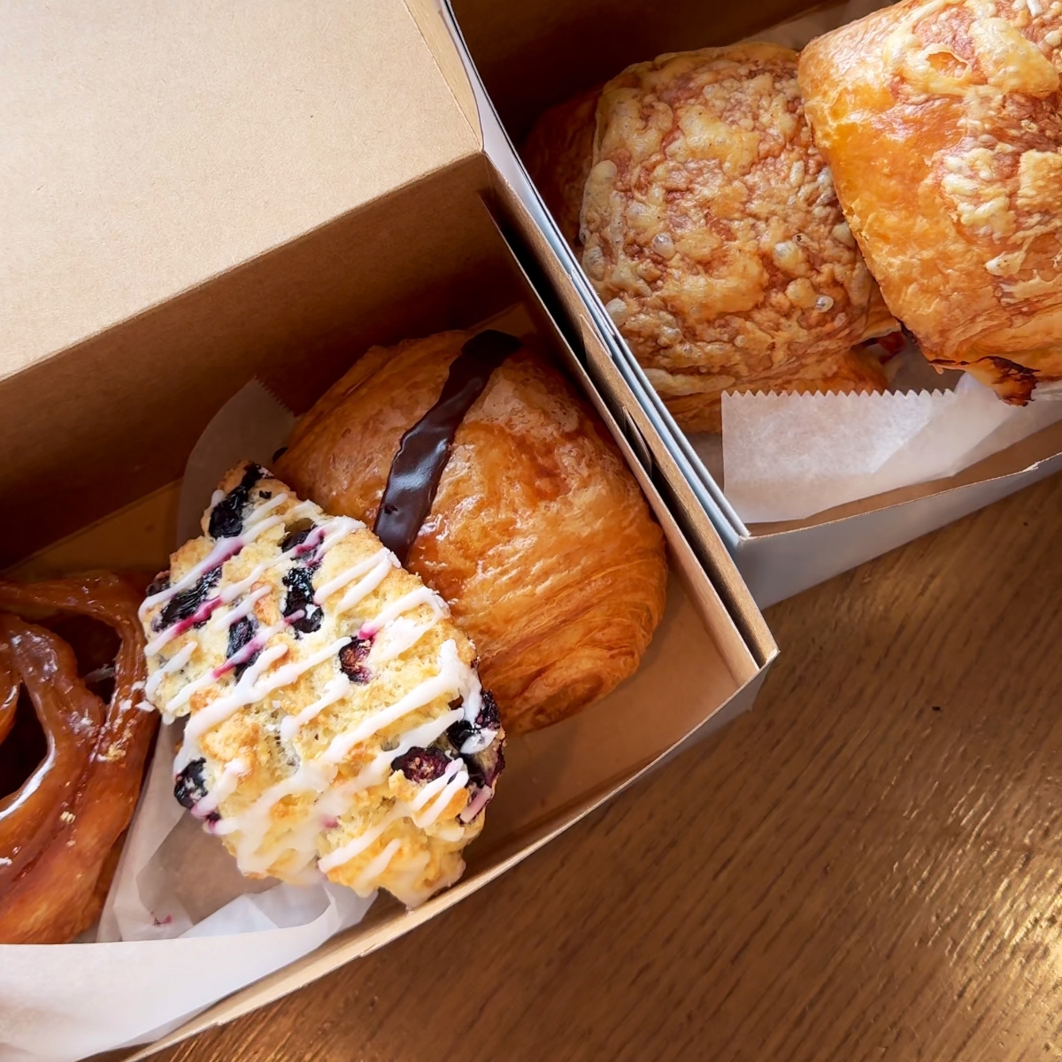 close up of bakery items in take out boxes